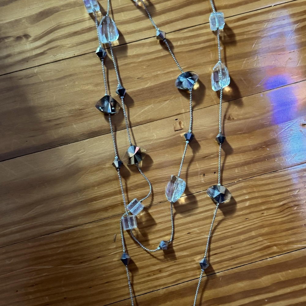 Silver necklace with clear and silver stones.
